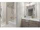 Neutral bathroom featuring a tub with shower, single vanity, and tile flooring at 3600 Goldenrod Dr, Alpharetta, GA 30005