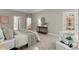 Bedroom boasts neutral tones, a decorative rug, sitting area, and access to the backyard, creating a serene retreat at 3600 Goldenrod Dr, Alpharetta, GA 30005