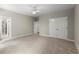 Bright bedroom features a closet with double doors, neutral walls, and carpeted floors at 3600 Goldenrod Dr, Alpharetta, GA 30005