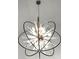 Close up of a modern chandelier with a starburst design and ambient lighting at 3600 Goldenrod Dr, Alpharetta, GA 30005