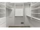 Well-organized walk-in closet with custom shelving and storage, providing ample space for wardrobe management at 3600 Goldenrod Dr, Alpharetta, GA 30005
