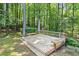 A backyard wooden deck has built in bench seating, making it a perfect area for relaxing and enjoying time outside at 3600 Goldenrod Dr, Alpharetta, GA 30005