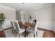 Inviting dining room with chair rail, statement lighting, and views to other areas of the home at 3600 Goldenrod Dr, Alpharetta, GA 30005