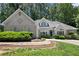 Beautiful home featuring a well-maintained lawn and mature trees at 3600 Goldenrod Dr, Alpharetta, GA 30005