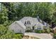 Beautiful home featuring a well-maintained lawn and mature trees at 3600 Goldenrod Dr, Alpharetta, GA 30005