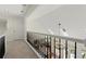 Second floor hallway features white and black railings overlooking the living area at 3600 Goldenrod Dr, Alpharetta, GA 30005