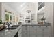 Bright kitchen featuring granite countertops, a double sink, and modern lighting at 3600 Goldenrod Dr, Alpharetta, GA 30005