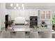 Bright kitchen with granite countertops, stainless steel appliances, and bar seating at 3600 Goldenrod Dr, Alpharetta, GA 30005