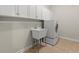 Well-organized laundry room with white cabinets, utility sink, and front-load washer at 3600 Goldenrod Dr, Alpharetta, GA 30005