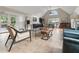 Open-concept living room with a modern kitchen, tiled floors, and a vaulted ceiling at 3600 Goldenrod Dr, Alpharetta, GA 30005