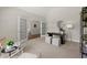 Cozy office space with neutral paint, statement lighting, french doors and stylish furnishings at 3600 Goldenrod Dr, Alpharetta, GA 30005