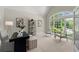 Bright office space with a large arched window, neutral paint, and stylish furnishings at 3600 Goldenrod Dr, Alpharetta, GA 30005