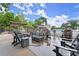 Stone-clad poolside lounge with comfortable seating around a gas fire pit at 3600 Goldenrod Dr, Alpharetta, GA 30005