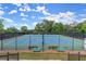 Enjoy a match on this well-maintained tennis court with benches and a scenic view at 3600 Goldenrod Dr, Alpharetta, GA 30005