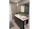 This bathroom features a double vanity, a large mirror, and a tiled shower at 507 Spring Creek Ne Way, Marietta, GA 30068