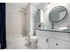 Stylish bathroom with a glass vessel sink, tub-shower combo, and modern fixtures at 507 Spring Creek Ne Way, Marietta, GA 30068