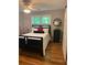 Cozy bedroom with a queen-sized bed, decorative accents, hardwood floors, and soft lighting, a restful retreat at 507 Spring Creek Ne Way, Marietta, GA 30068