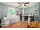 Bright bedroom with hardwood floors and a sewing station; a perfect space to be creative at 507 Spring Creek Ne Way, Marietta, GA 30068