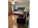 Spacious bedroom with beautiful hardwood floors, comfortable seating, and natural light at 507 Spring Creek Ne Way, Marietta, GA 30068