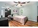 Bedroom featuring light-blue walls and natural light at 507 Spring Creek Ne Way, Marietta, GA 30068