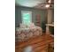Comfortable bedroom with hardwood floors, a cozy bed, and plenty of space at 507 Spring Creek Ne Way, Marietta, GA 30068