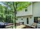 Exterior showcasing back of house with deck and green backdrop at 507 Spring Creek Ne Way, Marietta, GA 30068