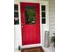 Charming red front door with glass panel and decorative welcome sign, inviting guests into a warm and welcoming home at 507 Spring Creek Ne Way, Marietta, GA 30068