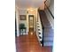 Inviting hallway with hardwood floors and staircase, leading to the upper level, creating a seamless flow throughout at 507 Spring Creek Ne Way, Marietta, GA 30068
