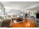 Spacious living room with hardwood floors, a fireplace, and a comfortable seating area at 507 Spring Creek Ne Way, Marietta, GA 30068