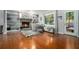 Inviting living room with hardwood floors, fireplace, and built-in bookshelves at 507 Spring Creek Ne Way, Marietta, GA 30068