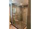 Modern bathroom shower with glass enclosure and tiled walls and floor at 507 Spring Creek Ne Way, Marietta, GA 30068