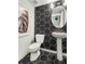 Modern bathroom features unique hexagon tile design and pedestal sink at 1088 Battery Park Rd, Decatur, GA 30033