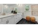 Modern bathroom features a double vanity and hexagon tile floors at 1088 Battery Park Rd, Decatur, GA 30033
