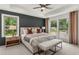 Bright bedroom with tray ceiling, many windows and neutral decor at 1088 Battery Park Rd, Decatur, GA 30033
