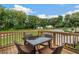 Outdoor deck with seating area, offering scenic views of the surrounding greenery and neighborhood at 1088 Battery Park Rd, Decatur, GA 30033