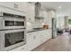 Modern kitchen boasts stainless appliances, stylish cabinetry, and an open layout at 1088 Battery Park Rd, Decatur, GA 30033