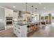 Spacious kitchen features a large island, stainless appliances, and modern lighting at 1088 Battery Park Rd, Decatur, GA 30033