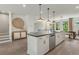 Open kitchen with an island, stainless steel dishwasher and a view to a dining area at 1088 Battery Park Rd, Decatur, GA 30033