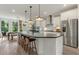 Bright and airy kitchen with oversized island, stainless fridge, and pendant lighting at 1088 Battery Park Rd, Decatur, GA 30033