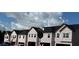 New construction townhomes featuring modern design and attached garages at 216 Seward St # 93, Conyers, GA 30094