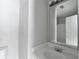 Bathroom featuring a functional vanity with a large mirror and a view of the shower and door at 3187 Mill Springs Cir, Buford, GA 30519