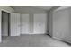 Neutral bedroom featuring plush carpeting and ample closet space at 3187 Mill Springs Cir, Buford, GA 30519