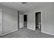 Comfortable carpeted bedroom with a convenient door that leads to the en-suite bathroom at 3187 Mill Springs Cir, Buford, GA 30519