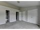 Neutral bedroom featuring plush carpeting, bathroom, and ample closet space at 3187 Mill Springs Cir, Buford, GA 30519