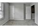 Well-lit bedroom with ample closet space and neutral tones, creating a blank canvas for personalization at 3187 Mill Springs Cir, Buford, GA 30519