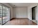 Spacious living room features hardwood floors, sliding glass doors, and a closet at 3187 Mill Springs Cir, Buford, GA 30519