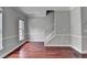 Spacious living room with hardwood floors, neutral walls and staircase at 3187 Mill Springs Cir, Buford, GA 30519