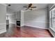 Living room with hardwood floors, a fireplace and a large window for natural light at 3187 Mill Springs Cir, Buford, GA 30519