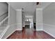Open living room showing hardwood floors, fireplace and view to the kitchen at 3187 Mill Springs Cir, Buford, GA 30519