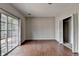 Spacious living room features hardwood floors, sliding glass doors, and a closet at 3187 Mill Springs Cir, Buford, GA 30519